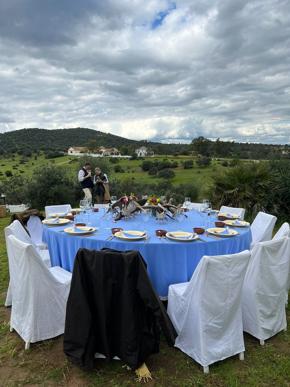 Shoot lunch laid in the field at Los Melonares, with the hacienda on the hillside beyond